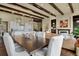 Open concept dining area with dark wood table and seating for six at 10510 Ladera Dr, Lone Tree, CO 80124