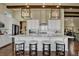 Modern kitchen with white cabinets and large island at 10510 Ladera Dr, Lone Tree, CO 80124