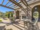 Outdoor patio area with brick fireplace and pergola, perfect for entertaining at 10510 Ladera Dr, Lone Tree, CO 80124