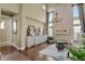 Sitting room with stone fireplace and hardwood floors at 10510 Ladera Dr, Lone Tree, CO 80124