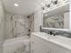This recently remodeled bathroom features updated tile and vanity and a shower and tub combo at 800 N Washington St # 1010, Denver, CO 80203