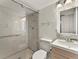 This modern bathroom features new tile in the shower, updated vanity, and modern lighting at 800 N Washington St # 1010, Denver, CO 80203