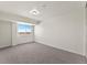 This bedroom features neutral walls and carpet and a large window at 800 N Washington St # 1010, Denver, CO 80203