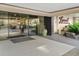 Building entryway showcasing glass doors, landscaping, and signage for the Lani at 800 Westside at 800 N Washington St # 1010, Denver, CO 80203