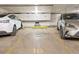 Indoor garage parking space for residents with assigned space numbers and electric vehicle at 800 N Washington St # 1010, Denver, CO 80203