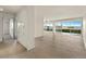Open living space showcasing floor to ceiling windows with city views and light hardwood floors at 800 N Washington St # 1010, Denver, CO 80203