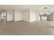 Open living space leading to the kitchen featuring hardwood floors and neutral walls at 800 N Washington St # 1010, Denver, CO 80203