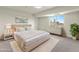 This primary bedroom has soft lighting and carpet, and a window with city views at 800 N Washington St # 1010, Denver, CO 80203