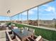 This covered patio has large windows and an outdoor dining area with views of the city skyline at 800 N Washington St # 1010, Denver, CO 80203
