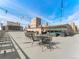 Spacious rooftop patio featuring comfortable seating and charming string lights, perfect for outdoor relaxation and entertainment at 800 N Washington St # 1010, Denver, CO 80203