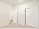 Bright bedroom with carpet flooring, double door closet and an additional door at 24018 E Atlantic Pl, Aurora, CO 80018