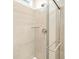 Modern shower with glass enclosure and built-in shelving at 24018 E Atlantic Pl, Aurora, CO 80018