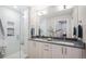 Modern bathroom with double vanity, marble shower and sleek finishes at 4469 Tennyson St # 4, Denver, CO 80212