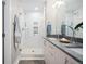 Modern bathroom with double vanity, marble shower and sleek finishes at 4469 Tennyson St # 4, Denver, CO 80212