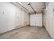View of the home's interior garage with visible overhead door and interior fixtures at 4469 Tennyson St # 4, Denver, CO 80212