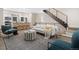 Open living space with hardwood floors, staircase, and plenty of room for entertaining at 4469 Tennyson St # 4, Denver, CO 80212