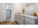 Bathroom with double vanity, granite countertop, and walk-in shower at 22052 E 38Th Pl, Aurora, CO 80019