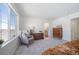 Bedroom with window seat, dresser, and access to bathroom at 22052 E 38Th Pl, Aurora, CO 80019