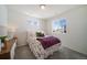 Bedroom with window, nightstand and floral bedding at 22052 E 38Th Pl, Aurora, CO 80019