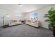 Spacious living room featuring two sofas and ample natural light at 22052 E 38Th Pl, Aurora, CO 80019