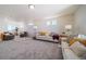 Relaxing living room with multiple seating areas and natural light at 22052 E 38Th Pl, Aurora, CO 80019