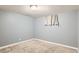 Spacious finished basement bedroom with neutral wall paint and carpet at 9676 Rensselaer Dr, Arvada, CO 80004