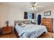 Spacious main bedroom with ceiling fan and dresser at 9676 Rensselaer Dr, Arvada, CO 80004