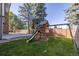 Backyard with playset, patio, and fenced-in area at 1661 Red Fox Pl, Highlands Ranch, CO 80126