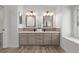 Modern bathroom with double vanity, gray tile, and updated fixtures at 1661 Red Fox Pl, Highlands Ranch, CO 80126