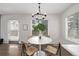 White round table with four chairs in bright dining area near window at 1661 Red Fox Pl, Highlands Ranch, CO 80126