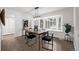 Dining room with a wood table, modern chairs, and large window at 1661 Red Fox Pl, Highlands Ranch, CO 80126