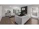 Living room with fireplace and view into dining area at 1661 Red Fox Pl, Highlands Ranch, CO 80126