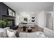 Living room with fireplace and view into dining area at 1661 Red Fox Pl, Highlands Ranch, CO 80126