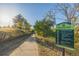 Paved trail with signage indicating park regulations at 1661 Red Fox Pl, Highlands Ranch, CO 80126