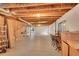 Unfinished basement featuring exposed ceiling, concrete floors, and a window at 3590 S Malaya St, Aurora, CO 80013