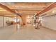 Spacious unfinished basement with exposed beams, ready to be personalized at 3590 S Malaya St, Aurora, CO 80013
