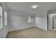 Neutral bedroom features soft carpet, a closet, and windows for natural light at 3590 S Malaya St, Aurora, CO 80013