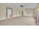 Large bedroom with a ceiling fan and doorway to the ensuite bathroom at 3590 S Malaya St, Aurora, CO 80013