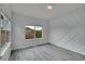 Stylish bedroom featuring gray wood floors, decorative wall trim and natural light at 3590 S Malaya St, Aurora, CO 80013