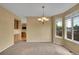 Neutral dining area features natural light from the large window at 3590 S Malaya St, Aurora, CO 80013