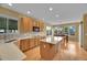 Bright kitchen with a large island, stainless appliances, and adjacent dining area at 3590 S Malaya St, Aurora, CO 80013