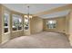 Spacious living room features a large bright window and neutral carpet at 3590 S Malaya St, Aurora, CO 80013