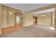 Open-concept living room featuring wood floors and staircase access at 3590 S Malaya St, Aurora, CO 80013