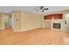 Large living room with fireplace, neutral color, and access to other rooms at 3590 S Malaya St, Aurora, CO 80013
