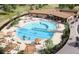 Inviting community pool featuring a waterfall, lounge chairs, and ample deck space at 17152 W 91St Ln, Arvada, CO 80007