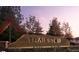 Entrance sign for Trailstone with stone base and metal accents at 17152 W 91St Ln, Arvada, CO 80007