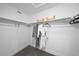 Walk-in closet with custom shelving and ample space for clothing and accessories at 17152 W 91St Ln, Arvada, CO 80007