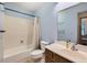 Bathroom featuring a tub with shower and neutral single sink vanity at 8236 Washington St # 29, Denver, CO 80229