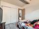 Bedroom with ample storage, vaulted ceiling beams, and neutral paint at 8236 Washington St # 29, Denver, CO 80229