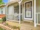 Inviting front porch featuring seating, stylish door, and well-maintained landscaping for added charm at 8236 Washington St # 29, Denver, CO 80229